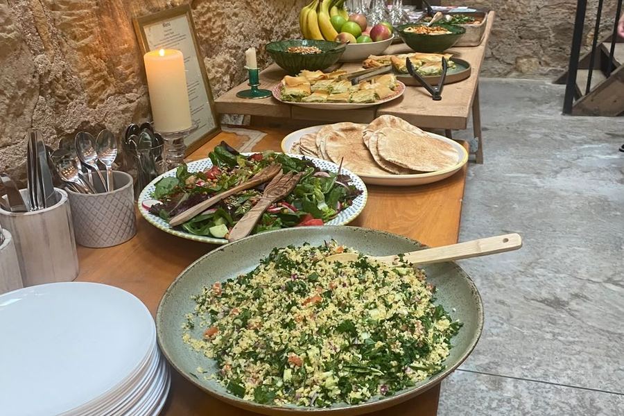 Mezze bowls with hummus, roasted chickpeas and fresh salad.